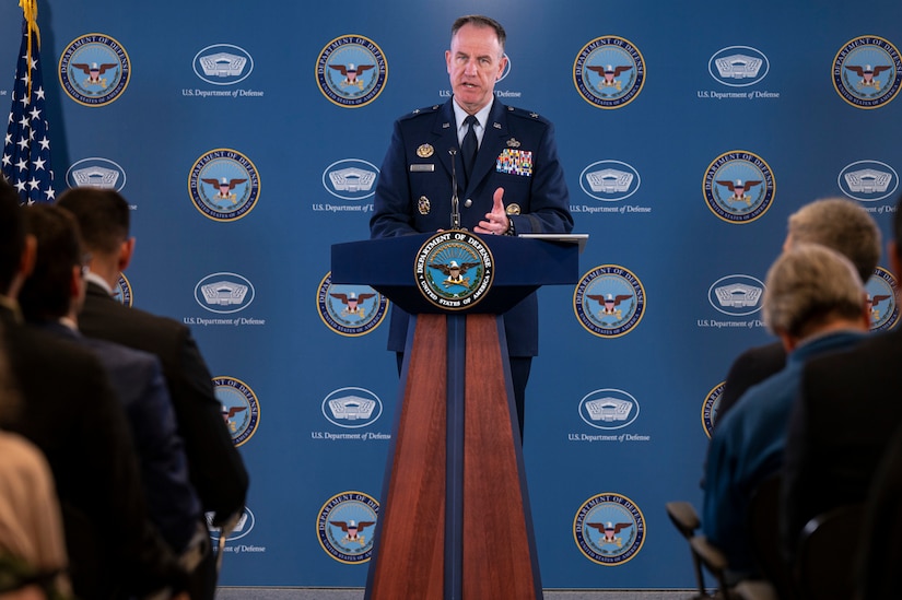 A man speaks from a podium.