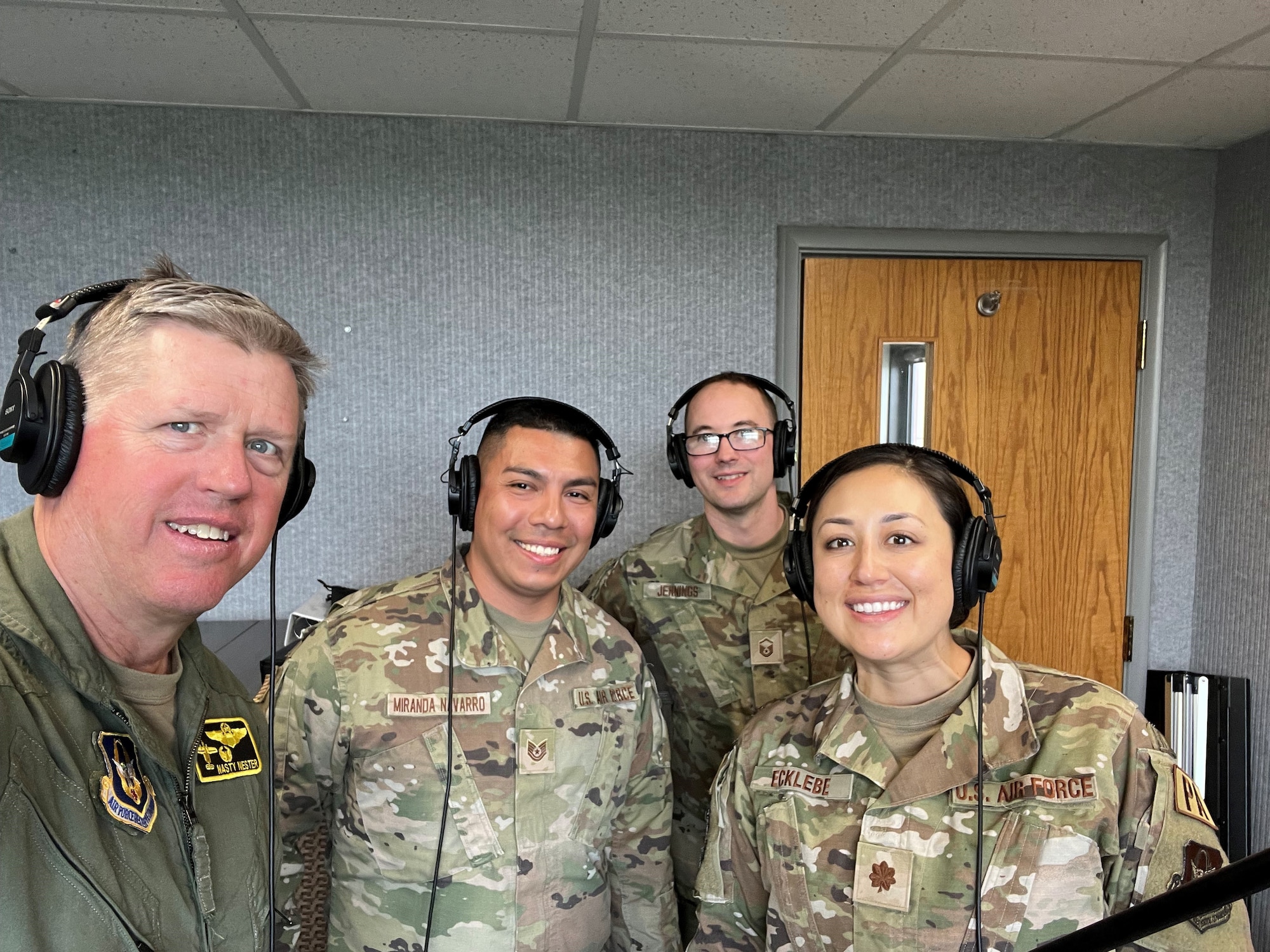 From left to right: Brig. Gen. Steve Nester, Tech. Sgt. Ricardo Miranda-Navarro, Master Sgt. Robert Jennings, and Maj. Shelley Ecklebe smile for the camera after completing a podcast for the 442d Fighter Wing on Apr. 20, 2023 at Whiteman AFB, Mo.