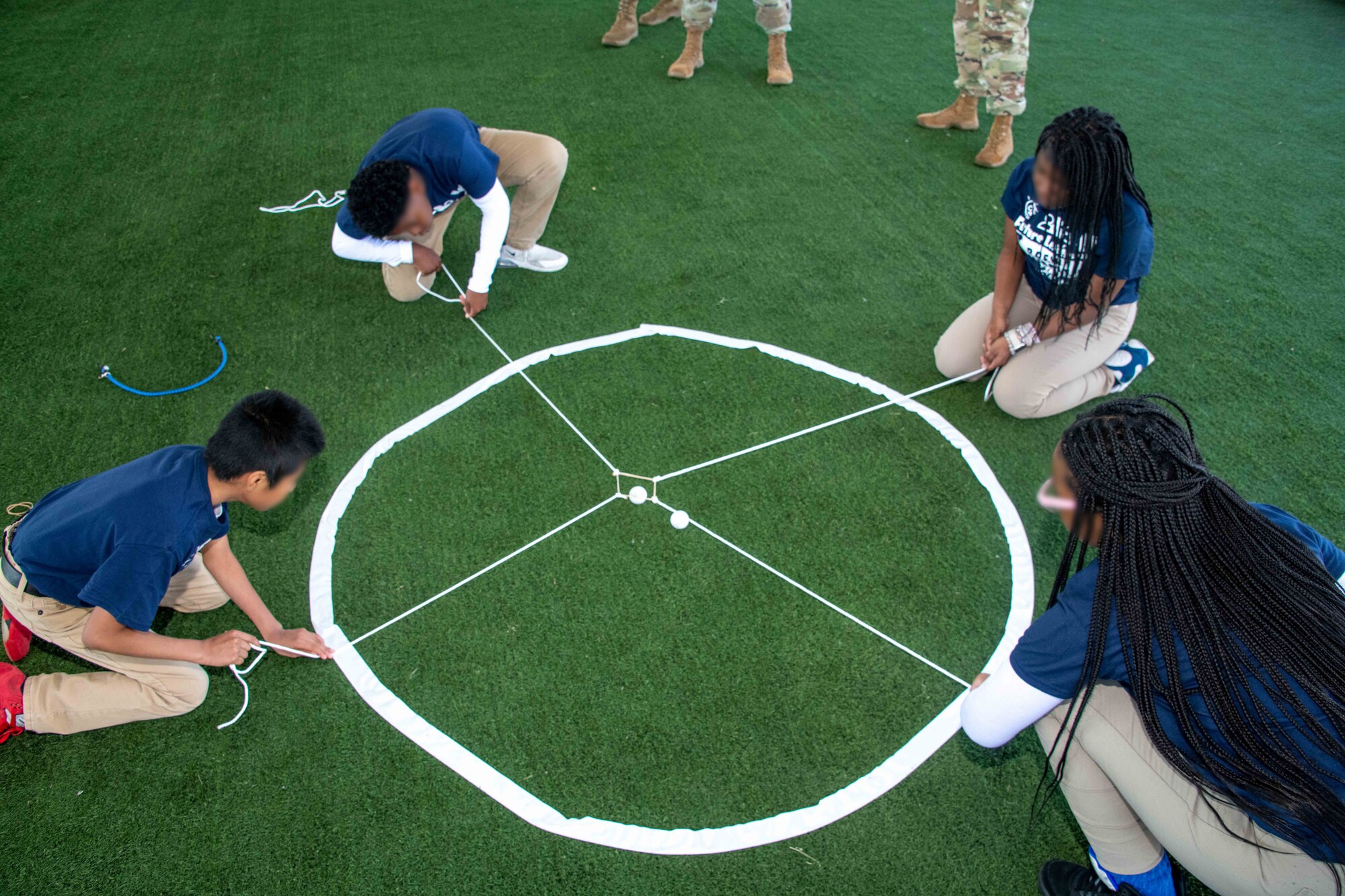 Students from Brewbaker Middle School take part in a leadership- and team-building activity on Maxwell Air Force Base, Alabama, April 18, 2023. The activity for 7th and 8th graders was part of the Brewbaker Middle School Outreach Day, a collaboration between the Montgomery Public Schools, Air University Innovation Research Task Force and the AU Innovation Office. The day was organized as a way to connect a small portion of the civilian population with military members to help dispel any misperceptions about serving, especially since less than 1% of the U.S. population is serving on active duty. (U.S. Air Force photo by Sean Ross)