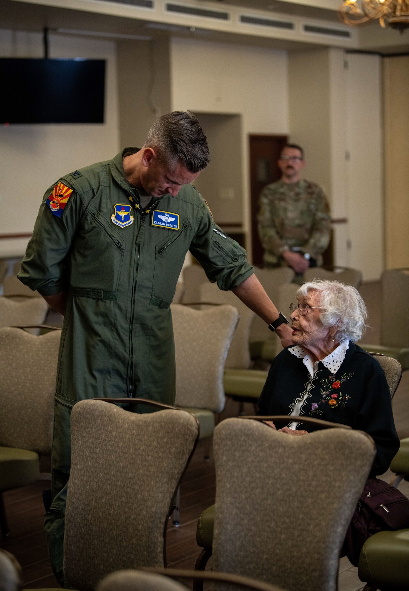 U.S. Air Force Col. Keegan McLeese, 56th Fighter Wing vice commander, speaks with Chris Cropps, 56th FW Chapel volunteer, during a Days of Remembrance event April 18, 2023, at Luke Air Force Base, Arizona.