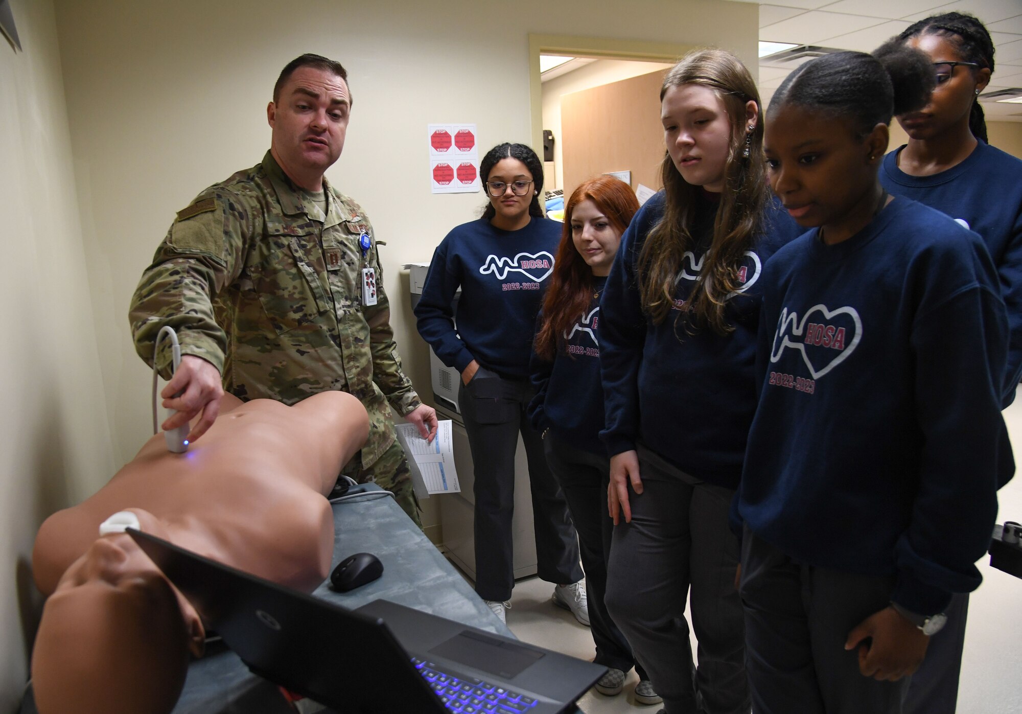 U.S. Air Force Capt. Josh Lowe, 81st Healthcare Operations Squadron emergency room physician, provides a simulated pericardial effusion and tamponade demonstration to Pascagoula and Gautier High School students inside the Keesler Medical Center at Keesler Air Force Base, Mississippi, April 21, 2023.