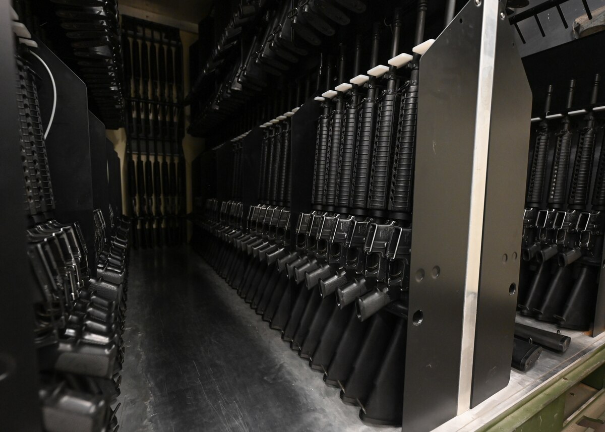 Firearms are stored in a crate.