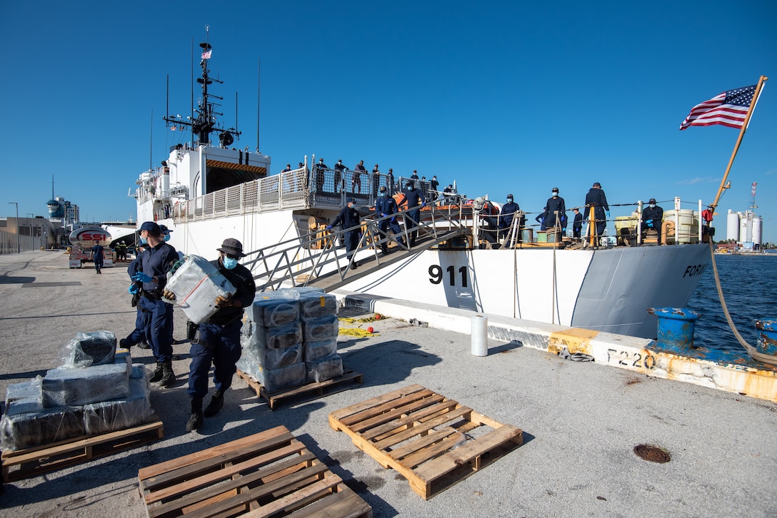 Coast Guard Cutter Forward crewmembers offload bales of illegal narcotics in Port Everglades, Florida, April 18, 2023. The Forward is homeported in Portsmouth, Virginia. (U.S. Coast Guard photo by Petty Officer 3rd Class Ryan Estrada)