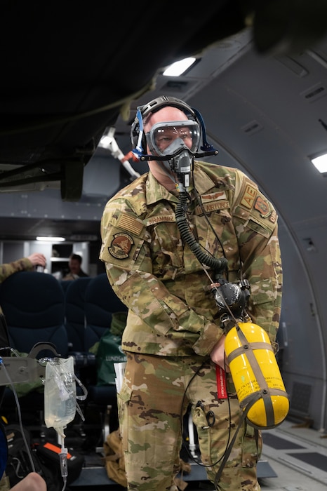 Image of an Airman holding a fire extinguisher during a training.