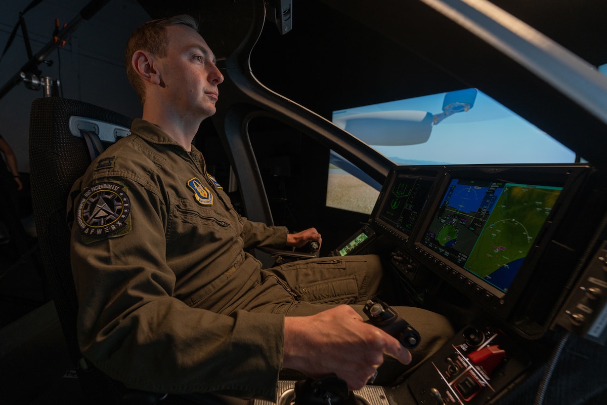 Capt. Terrence McKenna, test and experimentation lead for Agility Prime with the 370th Flight Test Squadron (FLTS), an Air Force Reserve Command unit out of Edwards Air Force Base, Calif., trains in a Joby S4 simulator. The Joby S4 is a five-seat electric vertical takeoff and landing (eVTOL) aircraft. (Courtesy photo)