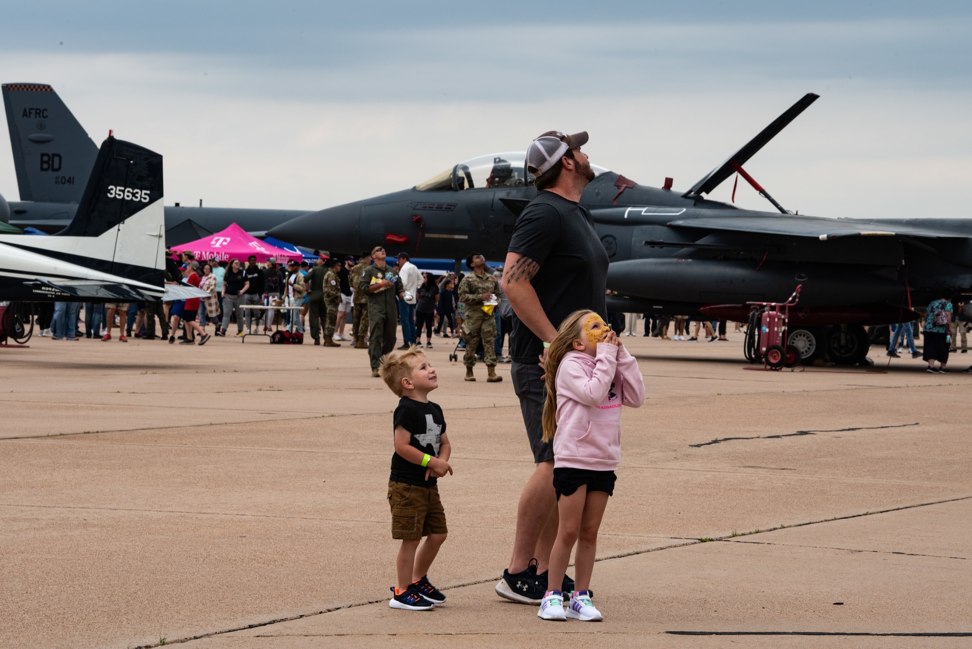 Air show attendees observe static displays during the 2023 Dyess Big Country Air Fest on Dyess Air Force Base, Texas, April 22, 2023. More than 30,000 event goers attended the one-day event highlighting the best of America’s only Lift and Strike base, Air Force heritage and Dyess community partners. The air show featured the F-22 Raptor demo team, U.S. Air Force Academy Wings of Blue, U.S. Army Golden Knights, WW II heritage flight and B-1B Lancer and C-130J Super Hercules fly overs. (U.S. Air Force photo by Airman 1st Class Alondra Cristobal Hernandez)
