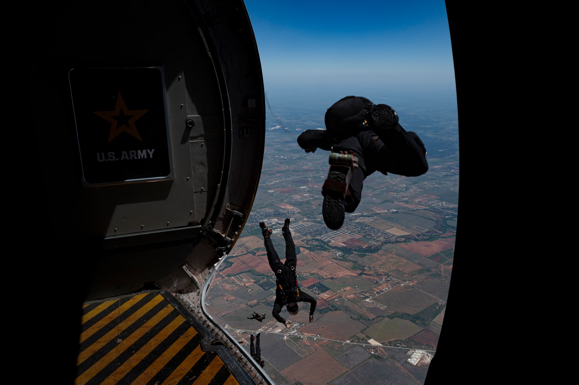 The U.S. Army Golden Knights perform during the 2023 Dyess Big Country Air Fest on Dyess Air Force Base, Texas, April 22, 2023. More than 30,000 event goers attended the one-day event highlighting the best of America’s only Lift and Strike base, Air Force heritage and Dyess community partners. The air show featured the F-22 Raptor demo team, U.S. Air Force Academy Wings of Blue, U.S. Army Golden Knights, WWII heritage flight and B-1B Lancer and C-130J Super Hercules fly overs. (U.S. Air Force photo by Senior Airman Josiah Brown)