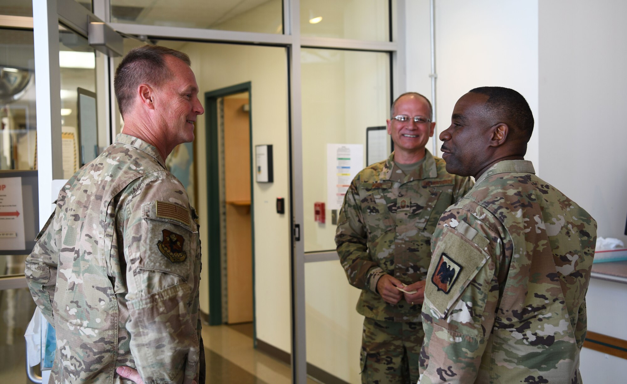 U.S. Air Force Chief Master Sgt. Maurice Williams, left, command chief, Air National Guard, speaks with Lt. Col. Robert Krooner, left, commander, 178th Medical Group, 178th Wing, Ohio National Guard, and Chief Master Sgt. Brian Wear, chief enlisted manager, 178th Medical group, , Oct. 15, 2022, in Springfield, Ohio. Krooner welcomed Williams to tour the medical group facilities and speak with some of the Airmen at work. (U.S. Air National Guard photo by Senior Airman Jillian Maynus)