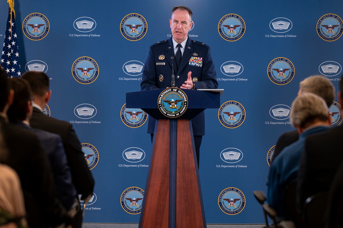 A man speaks from a podium.