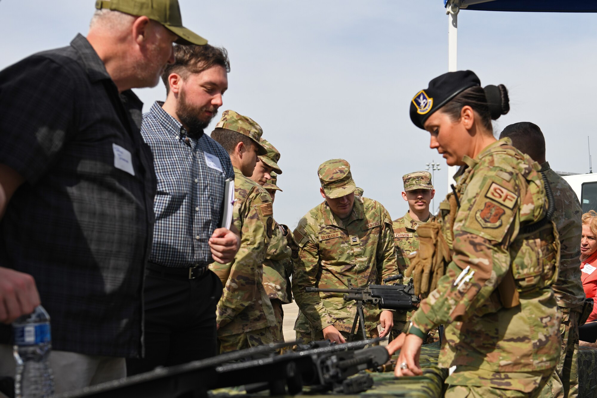 A Security Forces Airmen assigned to the Ohio Air National Guard’s 178th Wing engages with members of the community during the wing's Community Day, Arpil 20, 2023 in Springfield, Ohio. The event consisted of a briefing on the wing's capabilities and a base tour. (U.S. Air National Guard photo by Senior Airman Jill Maynus)