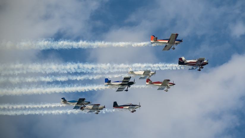 A group of aircraft from Smoke On Aviation performs an aerial demonstration over the Ohio River in downtown Louisville, Ky., on April 22, 2023, to kick of the annual Thunder Over Louisville air show. This year’s event featured more than 20 military and civilian planes, including a C-130J Super Hercules from the Kentucky Air National Guard, which served as the base of operations for military aircraft participating in the show. (U.S. Air National Guard photo by Dale Greer)