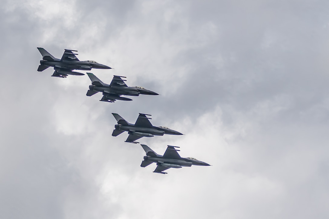 A group of U.S. Air Force F-16 Vipers from the Ohio Air National Guard fly over the Ohio River in downtown Louisville, Ky., on April 22, 2023, to kick of the annual Thunder Over Louisville air show. This year’s event featured more than 20 military and civilian planes, including a C-130J Super Hercules from the Kentucky Air National Guard, which served as the base of operations for military aircraft participating in the show. (U.S. Air National Guard photo by Dale Greer)