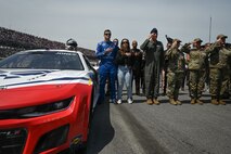 Photo of Erik Jones participating in the national anthem with Air Force Reserve leadership.