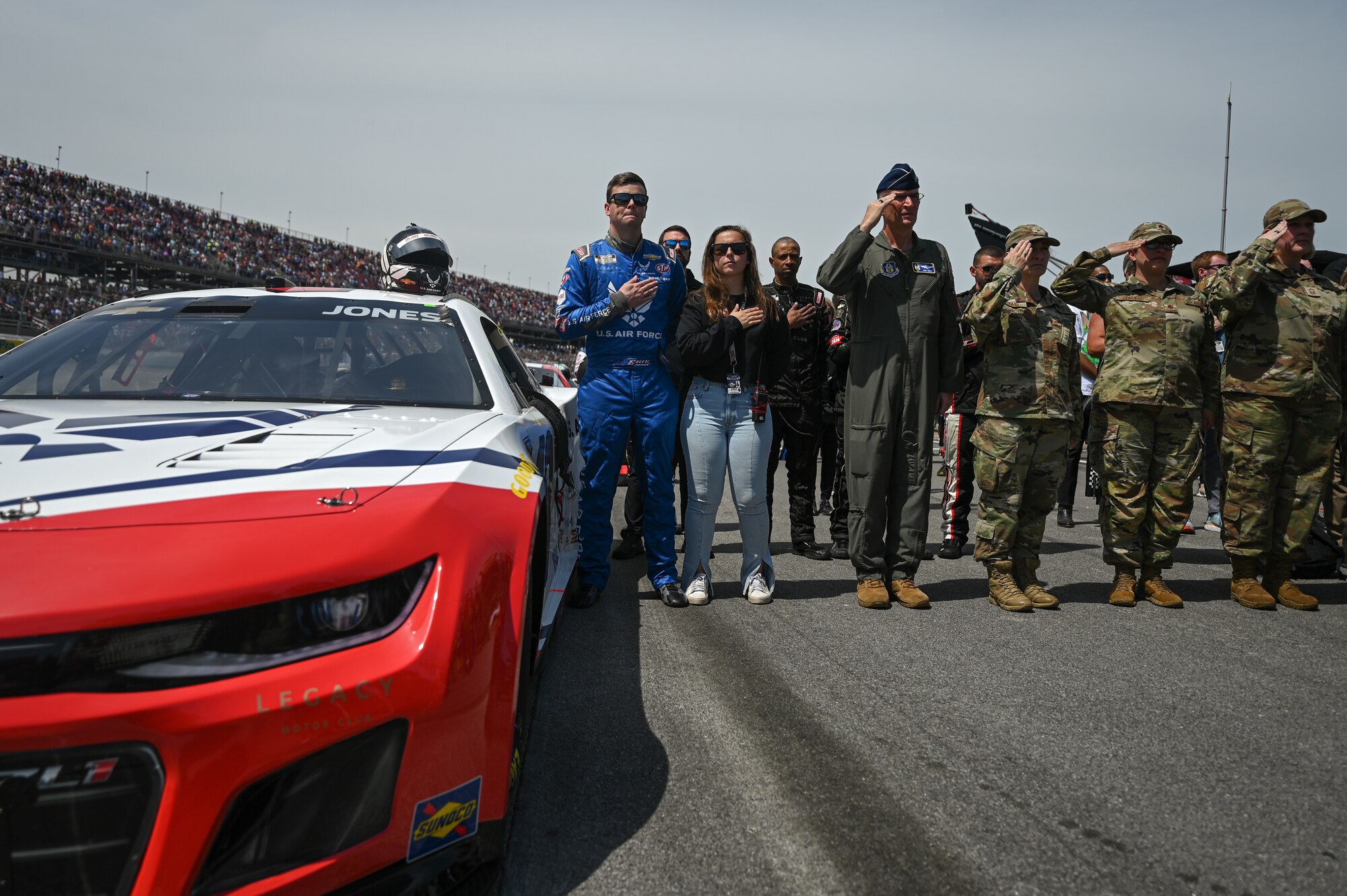 Photo of Erik Jones participating in the national anthem with Air Force Reserve leadership.
