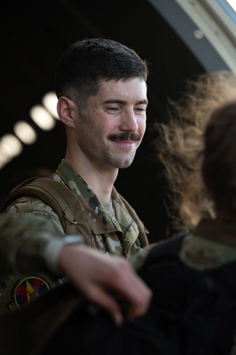 Staff Sergeant Mackenzie Jarocki, a 934th Aeromedical Evacuation Squadron flight medical technician, converses with fellow Airmen while waiting to disembark from a Boeing KC-46 Pegasus aircraft at St. Croix, U.S. Virgin Islands, March 23, 2023. During the flight, Jarocki worked with fellow noncommissioned officers to help oversee the training of less experienced crew members. (U.S. Air Force photo by Senior Airman Victoriya Tarakanova)