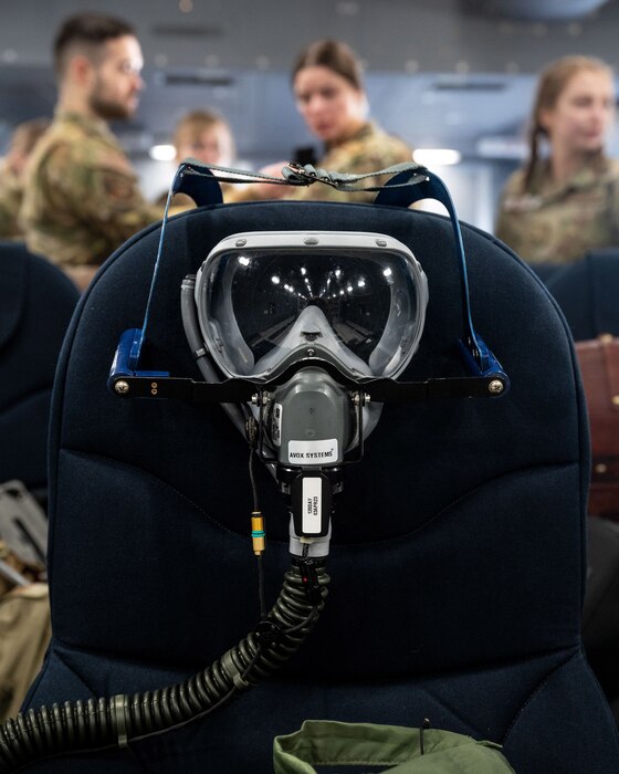 An oxygen mask hangs on a seat onboard a Boeing KC-46 Pegasus aircraft at the Minneapolis-St. Paul Air Reserve Station, Minnesota, March 23, 2023. The masks were used by crew members as a part of in-flight training for emergency situations. (U.S. Air Force photo by Senior Airman Victoriya Tarakanova)