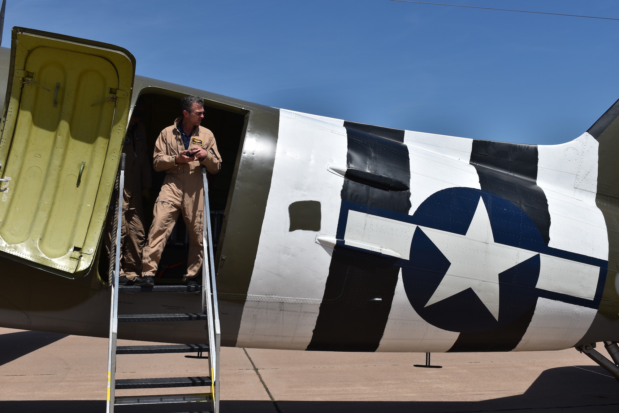 John Cotter, Commemorative Air Force Ghost Squadron C-47 pilot, prepares for a flight during the 2023 Dyess Big Country Air Fest rehearsal day at Dyess Air Force Base, Texas, April 21, 2023. More than 30,000 event goers attended the one-day event highlighting the best of America’s only Lift and Strike base, Air Force heritage and Dyess community partners. The air show featured the F-22 Raptor demo team, U.S. Air Force Academy Wings of Blue, U.S. Army Golden Knights, WWII heritage flight and B-1B Lancer and C-130J Super Hercules fly overs. (U.S. Air Force photo by Staff Sgt. Matthew Angulo)