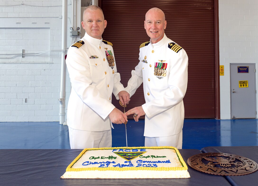 230421-N-DG679-008
JACKSONVILLE, Fla. (Apr. 21, 2023) (L-R) Capt. William Palmer and Capt. Grady Duffey prepare to cut the cake during the Fleet Readiness Center Southeast (FRCSE) change of command ceremony. Capt. William Palmer became FRCSE’s 45th commanding officer after relieving Capt. Grady Duffey during a change of command and retirement ceremony April 21st onboard Naval Air Station Jacksonville. (U.S. Navy photo by Toiete Jackson/Released)