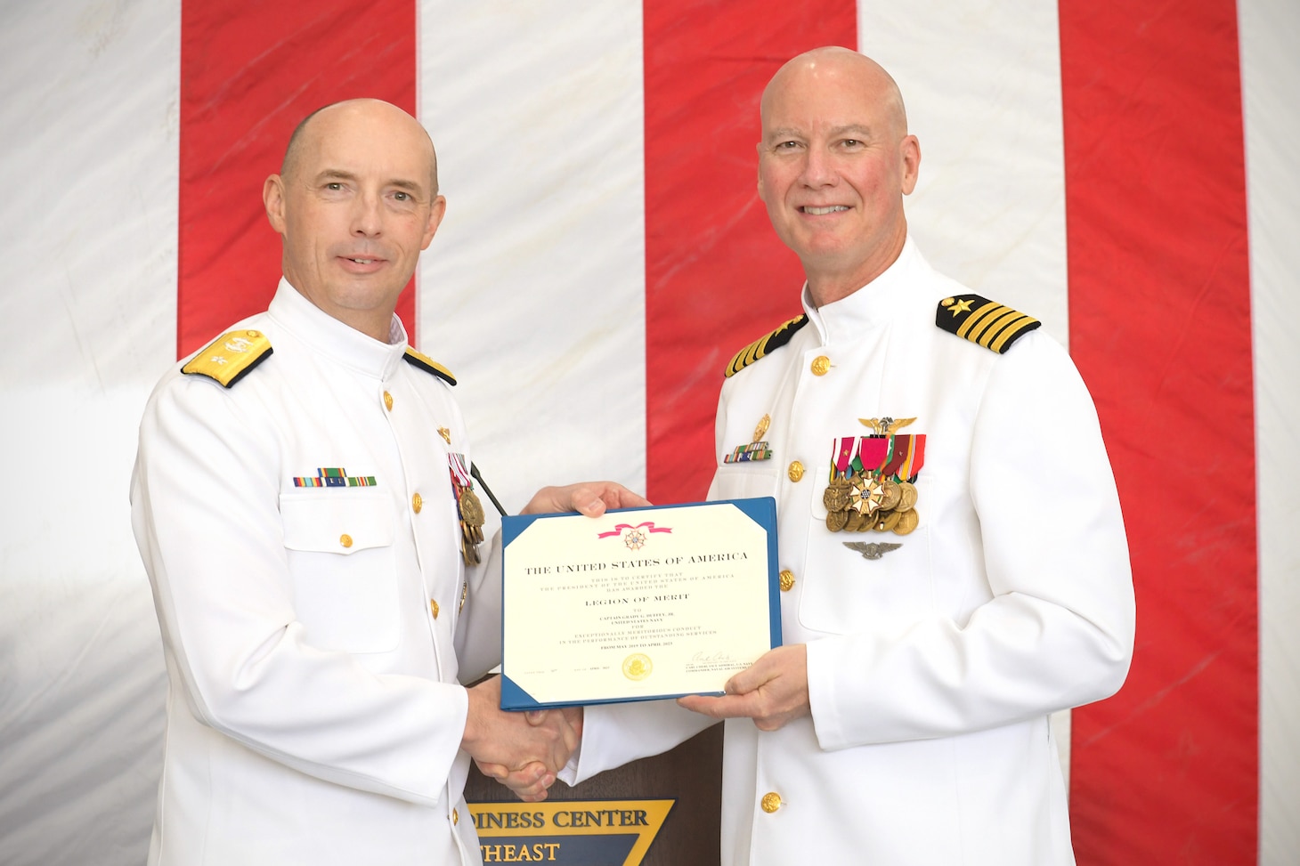 230421-N-DG679-003
JACKSONVILLE, Fla. (Apr. 21, 2023) Rear Adm. Joseph Hornbuckle, commander, Fleet Readiness Centers presents Capt. Grady Duffey with the Legion of Merit during the Fleet Readiness Center Southeast (FRCSE) change of command ceremony. Capt. William Palmer became FRCSE’s 45th commanding officer after relieving Capt. Grady Duffey during a change of command and retirement ceremony April 21st onboard Naval Air Station Jacksonville. (U.S. Navy photo by Toiete Jackson/Released)