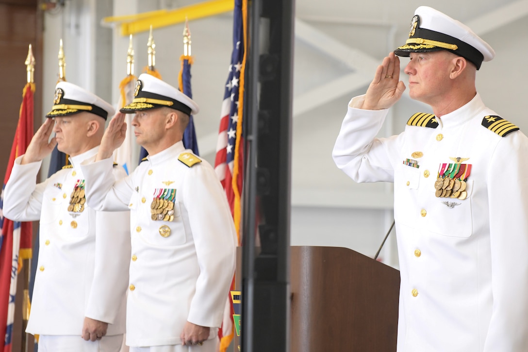 230421-N-DG679-001
JACKSONVILLE, Fla. (Apr. 21, 2023) (L-R) Capt. William Palmer, Rear Adm. Joseph Hornbuckle and Capt. Grady Duffey salute the national ensign during the Fleet Readiness Center Southeast (FRCSE) change of command ceremony. Capt. William Palmer became FRCSE’s 45th commanding officer after relieving Capt. Grady Duffey during a change of command and retirement ceremony April 21st onboard Naval Air Station Jacksonville. (U.S. Navy photo by Toiete Jackson/Released)