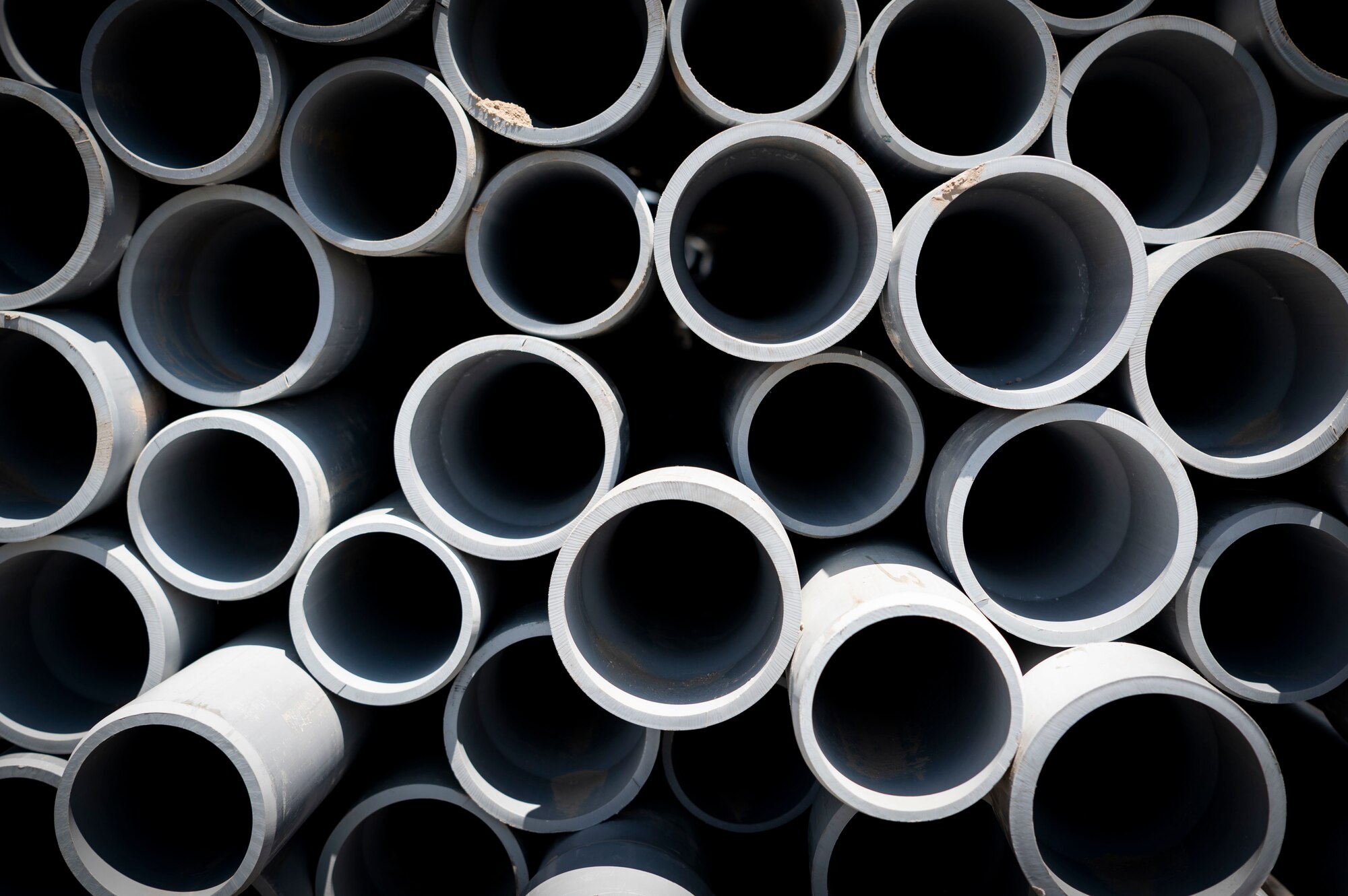 A stack of conduit is set aside during the installation process for a new tower at Cargo City, Kuwait, April 19, 2023.