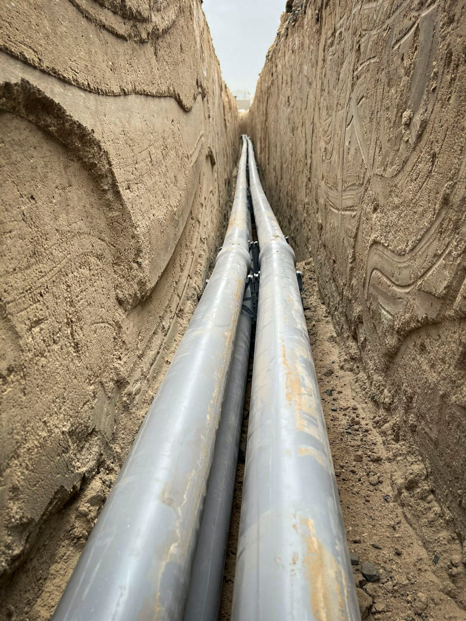 Conduit is laid during the installation process for a new tower at Cargo City, Kuwait, April 2023.