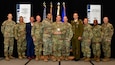 Military leaders from National Guard Bureau, Pennsylvania National Guard and Lithuania pose for a photo during an award ceremony April 19, 2023, in Denver, Colorado, that named them 2022 State Partnership of the Year. The annual conference, held April 17-21, 2023, brought together all 54 SPP directors, coordinators, and senior enlisted leaders to develop innovative solutions to pressing challenges, assisting our Partner Nations. The conference culminated with an awards ceremony where a partner country of the year and a bilateral affairs officer of the year were announced. (U.S. National Guard photo by: Sgt. 1st Class Elizabeth Pena)