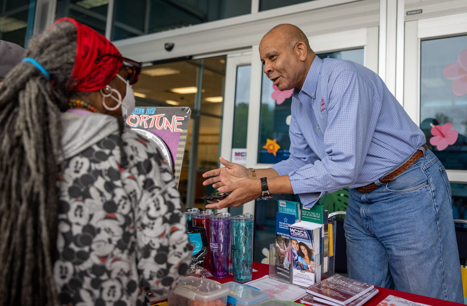 Thomas Brown an alcohol abuse preventions specialist with the Drug Enforcement Agency (DEA) educates Marine Corps Base Quantico residents about the National Drug Take Back Day Initiative (NDTBDI) at the Marine Corps Exchange on Marine Corps Base Quantico, Virginia, April 22, 2023. NDTBDI is hosted by the DEA to provide a safe, convenient and responsible means of disposing expired and unused prescription medications. (U.S. Marine Corps photo by Lance Cpl. Joaquin Carlos Dela Torre)