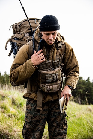 U.S. Marine Corps Sgt. Kaleb Miller, a section leader with 2d Light Armored Reconnaissance Battalion attached to Task Group 61/2.4, communicates with a UH-1Y Venom helicopter pilot near Saaremaa, Estonia, May 22, 2022. Task Group 61/2.4 provides naval and joint force commanders with dedicated multi-domain reconnaissance and counter-reconnaissance (RXR) capabilities. Task Group 61/2.4, under Task Force 61/2, is executing the Commandant of the Marine Corps’ Concept for Stand-in Forces (SIF) to generate small, highly versatile units that integrate Marine Corps and Navy forces.  Task Force 61/2 is deployed in the U.S. Naval Forces Europe area of operations, employed by U.S. Sixth Fleet to defend U.S., Allied and Partner interests. (U.S. Marine Corps photo by Sgt. Dylan Chagnon)