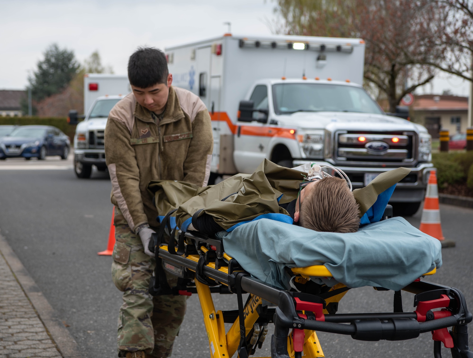 A man transports a victim that is injured.