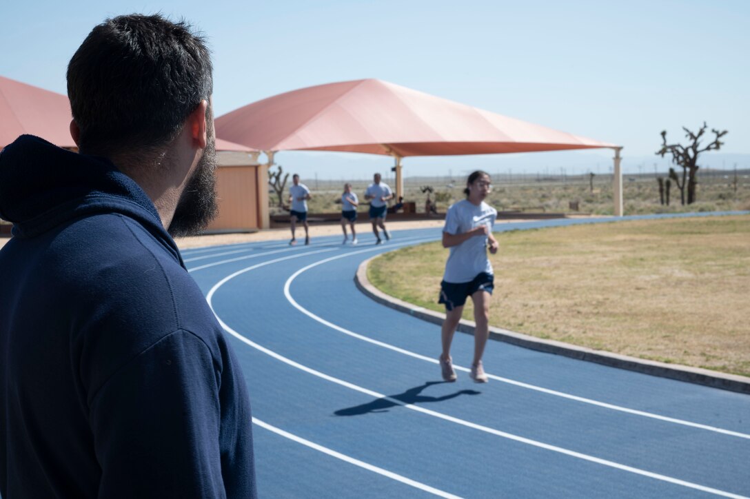 Edwards AFB Airmen test out the newly unveiled state-of-the-art fitness track during a PT fitness test at Rosburg Fitness Center on Edwards Air Force Base, California, April 24. This is the same track surface used for the 2021 Tokyo Olympics and is known as "the most technologically advanced athletic track in the world."