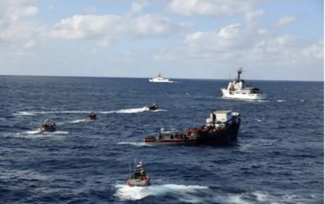 USCGC Tampa (WMEC 902), USCGC James (WMSL 754), USCGC Vigilant (WMEC 617) and USCGC Isaac Mayo (WPC 1112) interdict an 80-foot trawler named Miss Biddy carrying 311 Haitian migrants Feb. 15, 2023 in international waters. Support for the interdiction also came from Coast Guard Air Station Clearwater and Customs and Border Protection Air and Marine Operations. (U.S. Coast Guard photo courtesy USCGC James)