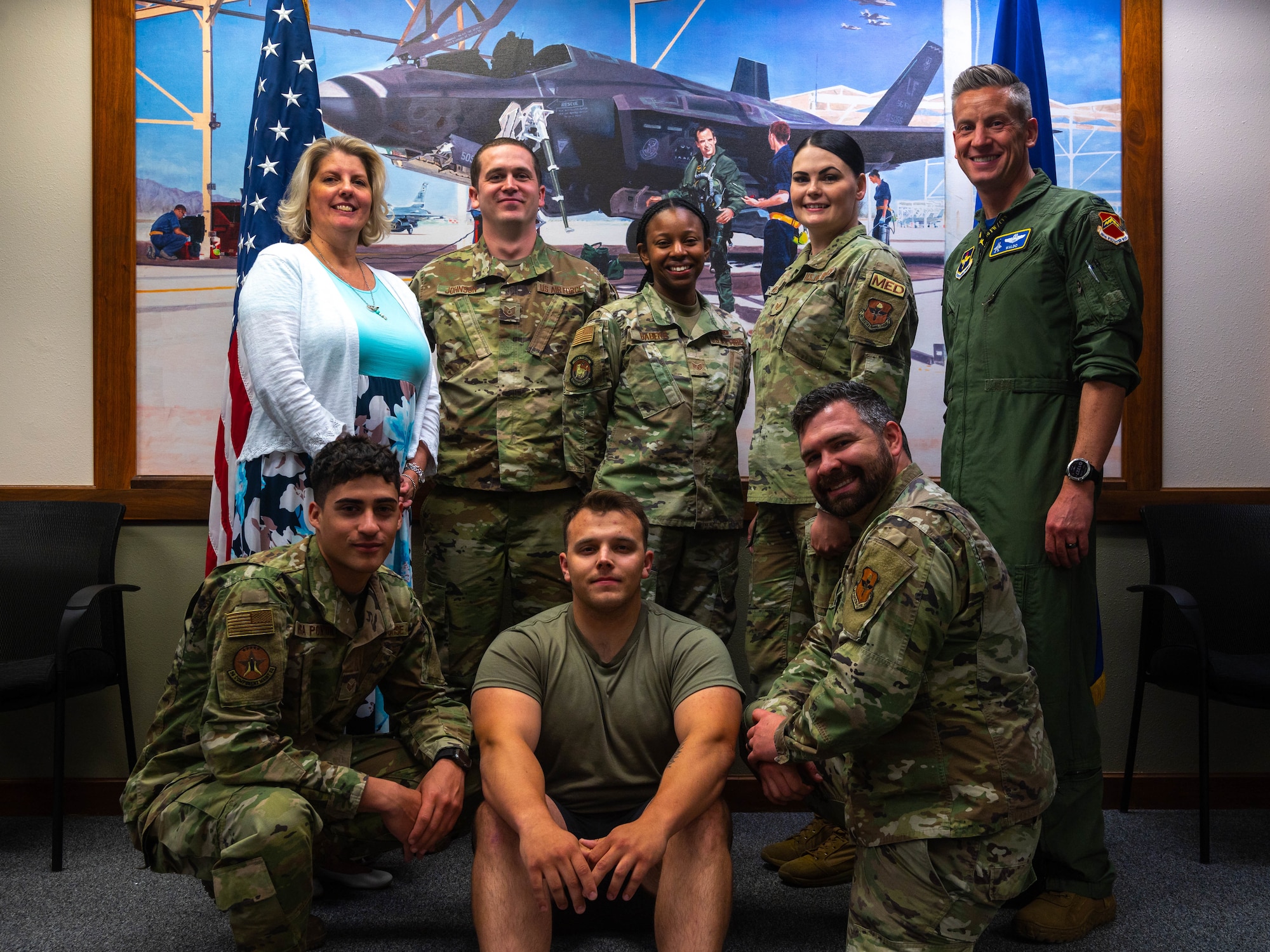 Jennifer Schoen (left), 56th Fighter Wing Sexual Assault Response Coordinator, and U.S. Air Force Col. Keegan McLeese, (right) 56th Fighter Wing vice commander, poses for a group photo with volunteer victim advocates from the Luke Air Force Base Sexual Assault Prevention and Response office, April 21, 2023, at Luke AFB, Arizona.