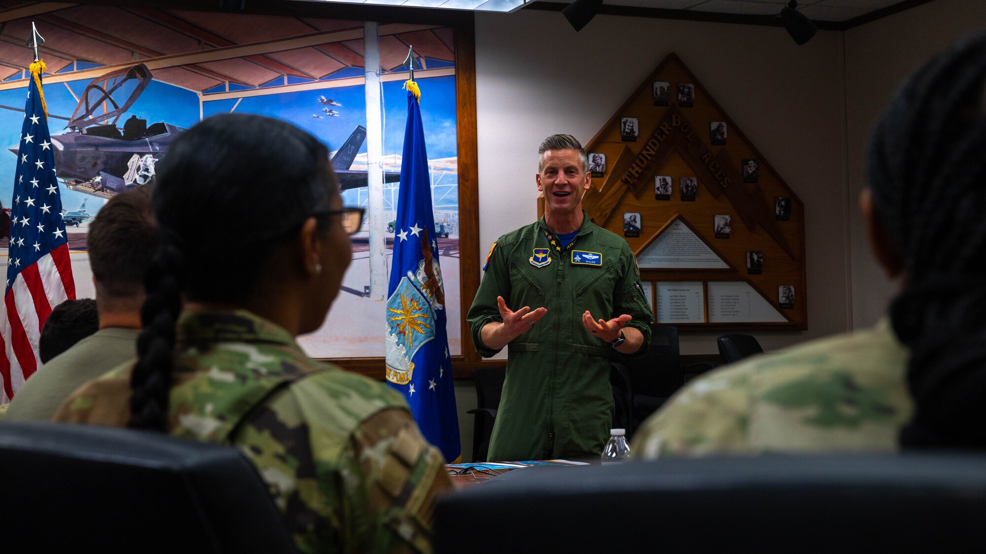 U.S. Air Force Col. Keegan McLeese, 56th Fighter Wing vice commander, addresses a group of volunteer victim advocates from the 56th Fighter Wing, April 21, 2023, at Luke Air Force Base, Arizona.
