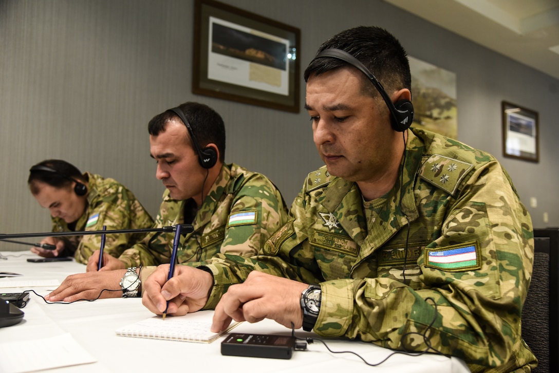 Personnel from the United States, Tajikistan, Uzbekistan, Kazakhstan, Mongolia, Kyrgyzstan and Pakistan work together at the Mid Planning Conference, or MPC, for Regional Cooperation 23 April 18-19, 2023, in Helena, Montana.  RC 23 is an annual, multi-national U.S. Central Command-sponsored exercise conducted by U.S. forces in partnership with Central and South Asia nations. During the MPC, the attendees worked to further develop the exercise scenario, which will take place in Helena later this year. (U.S. Army National Guard photo by Sgt. 1st Class Terra C. Gatti)