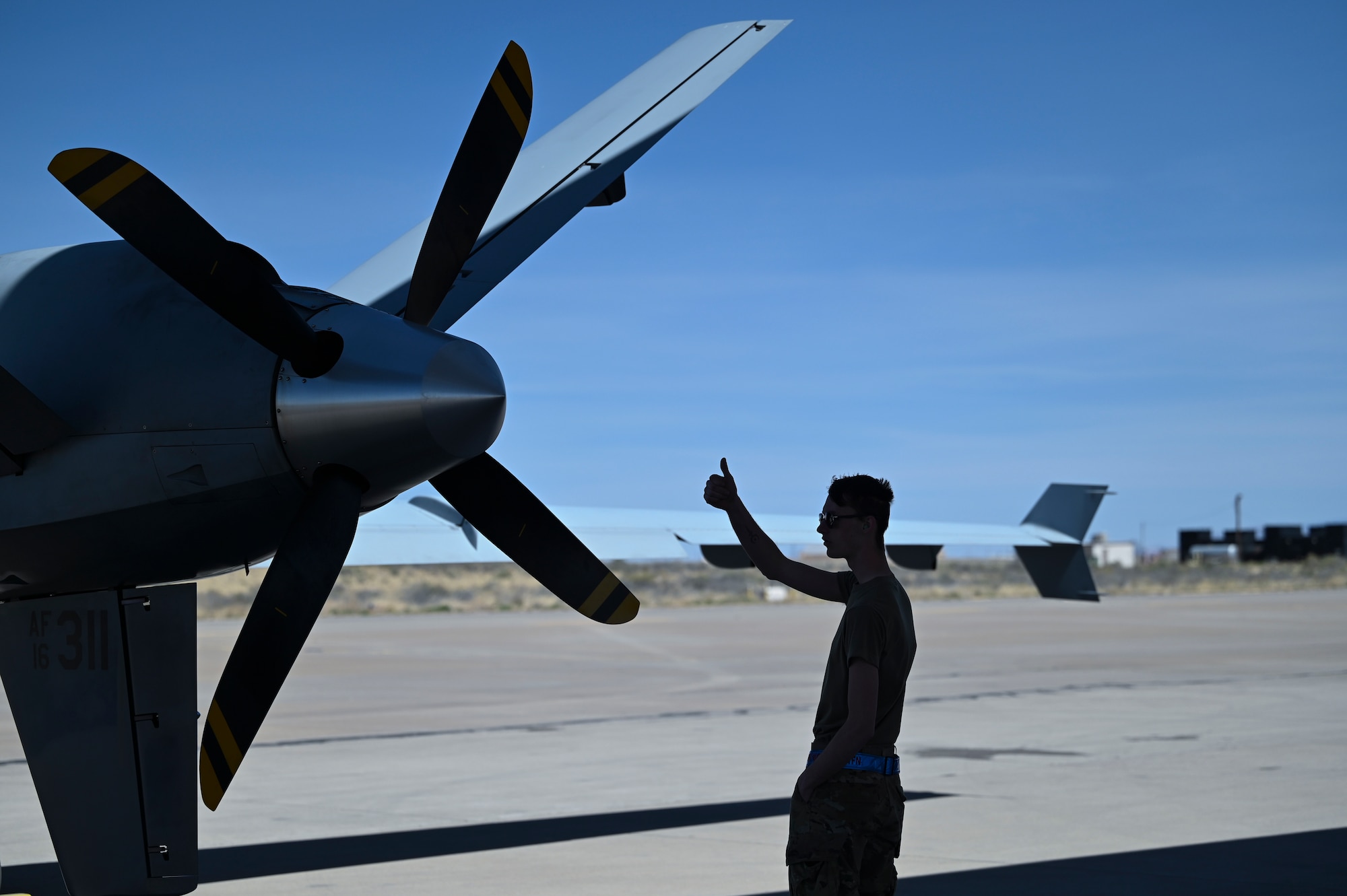 U.S. Air Force Airman 1st Class Kyle Phelps, 9th Aircraft Maintenance Unit maintainer, prepares an MQ-9 for taxi April 21, 2023