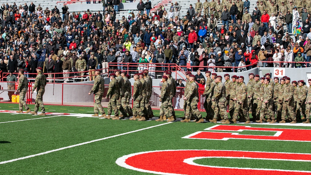 Friends, family and colleagues gathered together April 16, 2023, at Memorial Stadium in Lincoln, Nebraska, for a send-off ceremony for 131 Nebraska National Guard Soldiers of Alpha Company, 2-134th Infantry Battalion (Airborne).