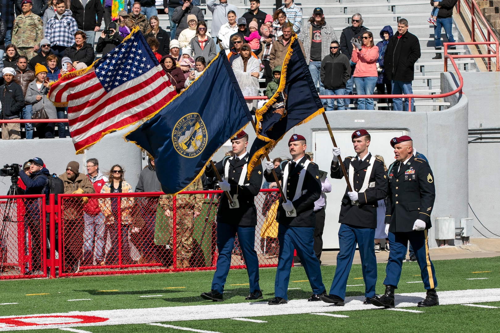 Friends, family and colleagues gathered together April 16, 2023, at Memorial Stadium in Lincoln, Nebraska, for a send-off ceremony for 131 Nebraska National Guard Soldiers of Alpha Company, 2-134th Infantry Battalion (Airborne).