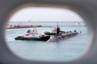 The Ohio-class ballistic-missile submarine USS Maine (SSBN 741) arrives at Naval Base Guam for a logistics stop, April 18.
