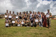 Recipients of the President’s Volunteer Service Award pose for a group photo after a volunteer recognition and appreciation ceremony at Marine Corps Base Hawaii, April 21, 2023. The ceremony recognized and honored individuals who demonstrated a sustained commitment to volunteer service over the course of 12 months. (U.S. Marine Corps photo by Sgt. Julian Elliott-Drouin)