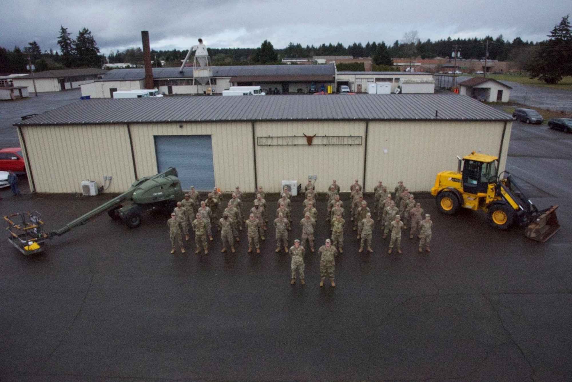 The 627th Civil Engineer Squadron poses for a group photo on Joint Base Lewis-McChord, Washington, April 7, 2023. The 627th CES mission is to enable joint warfighters through building combat ready engineers and strengthening the joint base. Their continued dedication to the mission, along with their squadron vision to train ready, reliable, and integrated Airmen has led them to receive the 2022 Maj. Gen. Clifton D. Wright award at the Air Mobility Major Command level