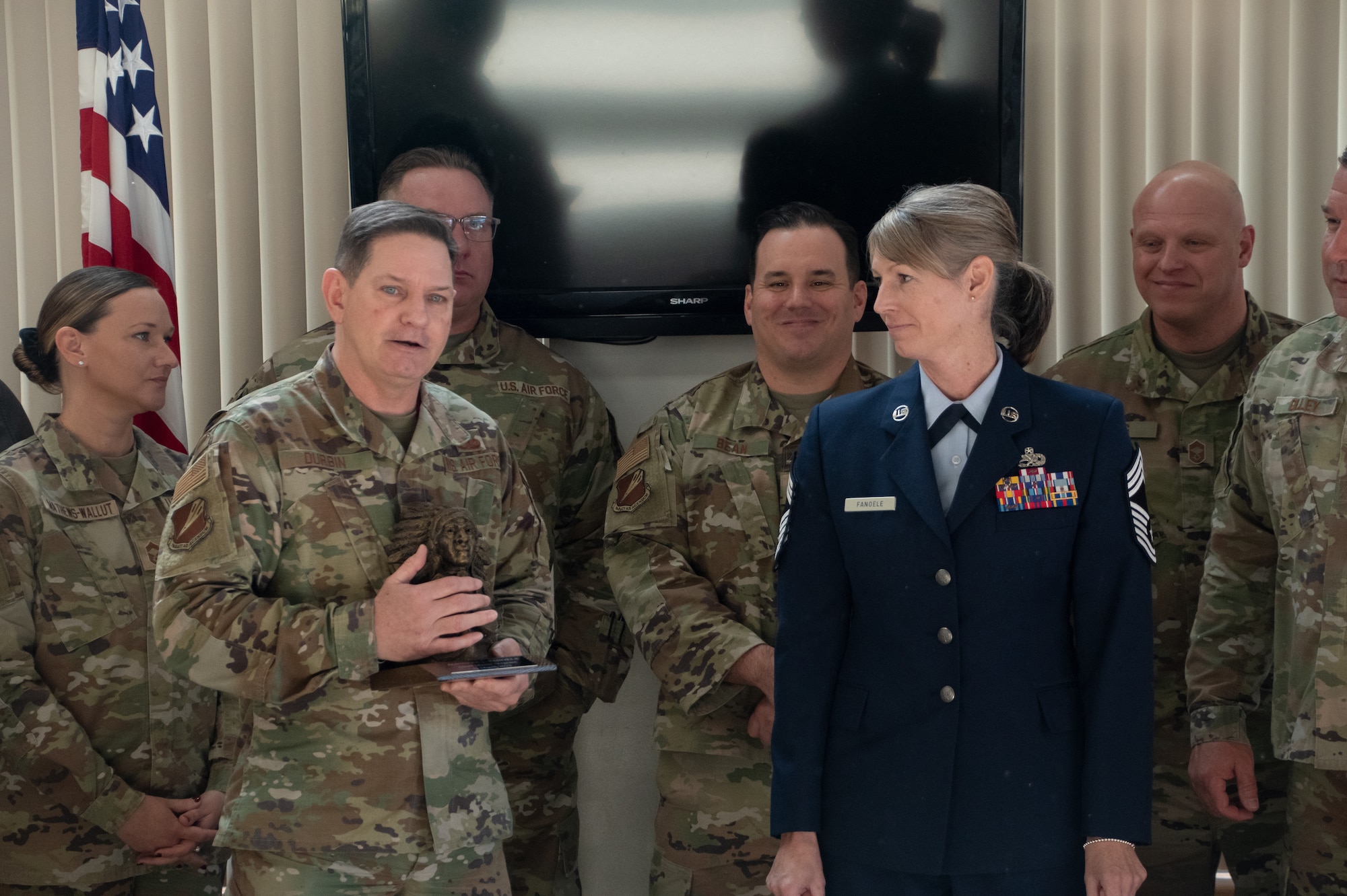 Chief Master Sgt. Jennifer Fanoele, 131st Bomb Wing Maintenance Operations Flight senior enlisted leader, is welcomed into her new rank by current and past chief master sergeants at her promotion ceremony on the Royal Oak Golf Course, Knob Noster Missouri, April 1, 2023. Fanoele has served with distinction for 23 years and continues to be an asset to the Missouri Air National Guard. (U.S. Air National Guard photo by Senior Airman Kelly C. Ferguson)