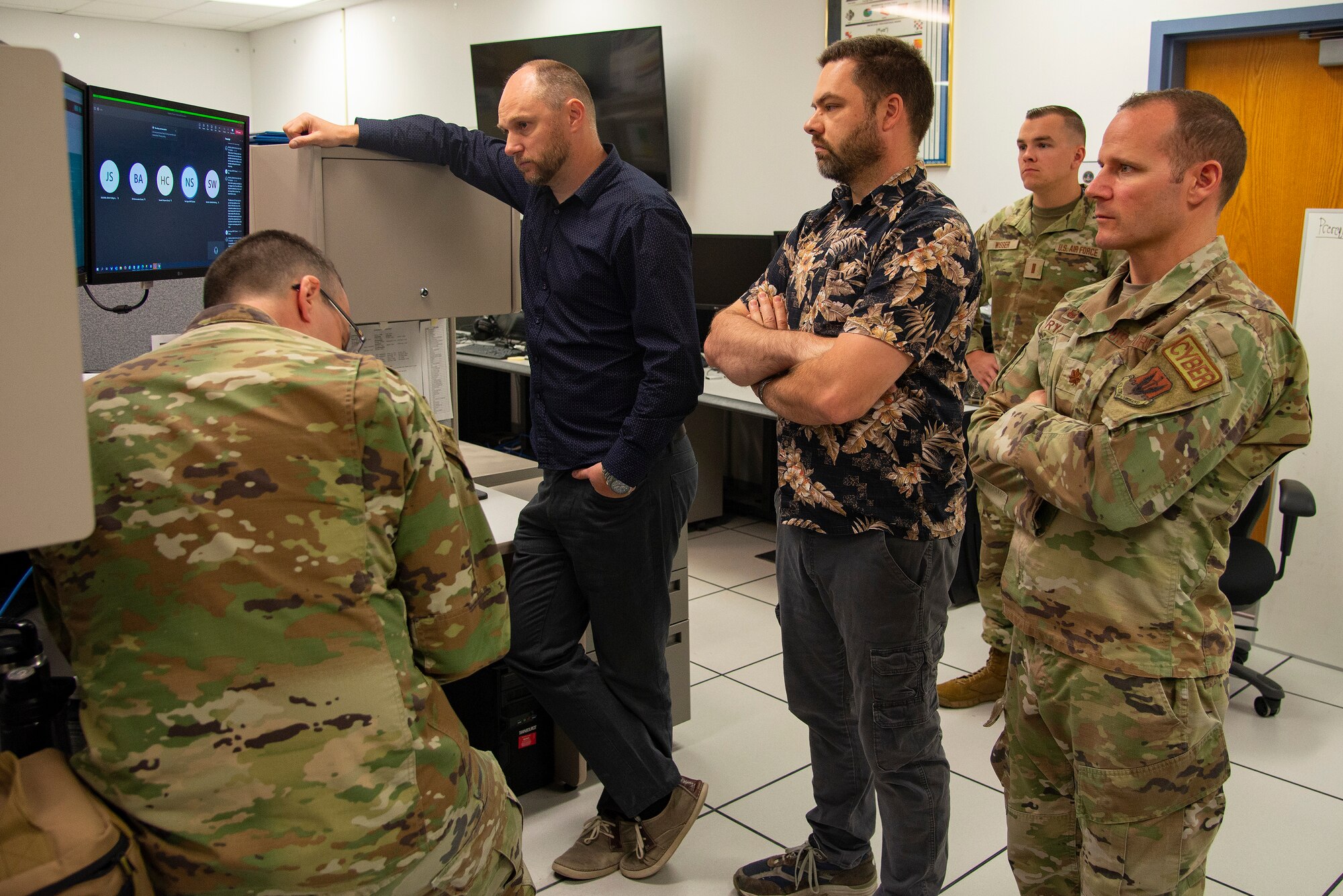 An image of members of the 177th Fighter Wing Communications Squadron “ShadowProject” team conducting an audio teleconference.