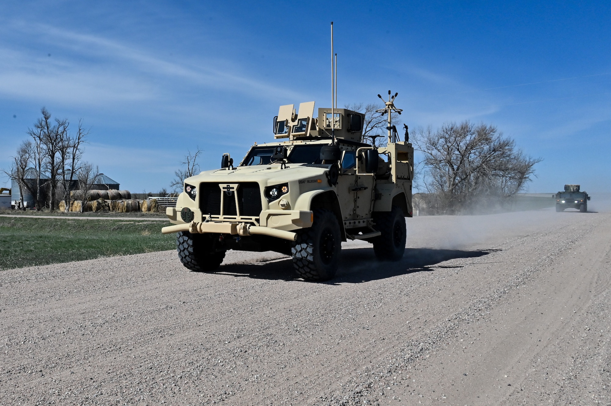 Airmen from the 90th Missile Security Forces Squadron conduct the first operational Joint Light Tactical Vehicle mission supporting maintenance at a launch facility near Harrisburg, Nebraska, April 24, 2023. This is the first step in modernizing the security forces vehicle fleet to provide more lethality and security for the nuclear enterprise. (Air Force photo by Joseph Coslett Jr.)