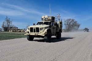 Airmen from the 90th Missile Security Forces Squadron conduct the first operational Joint Light Tactical Vehicle mission supporting maintenance at a launch facility near Harrisburg, Nebraska, April 24, 2023. This is the first step in modernizing the security forces vehicle fleet to provide more lethality and security for the nuclear enterprise. (Air Force photo by Joseph Coslett Jr.)