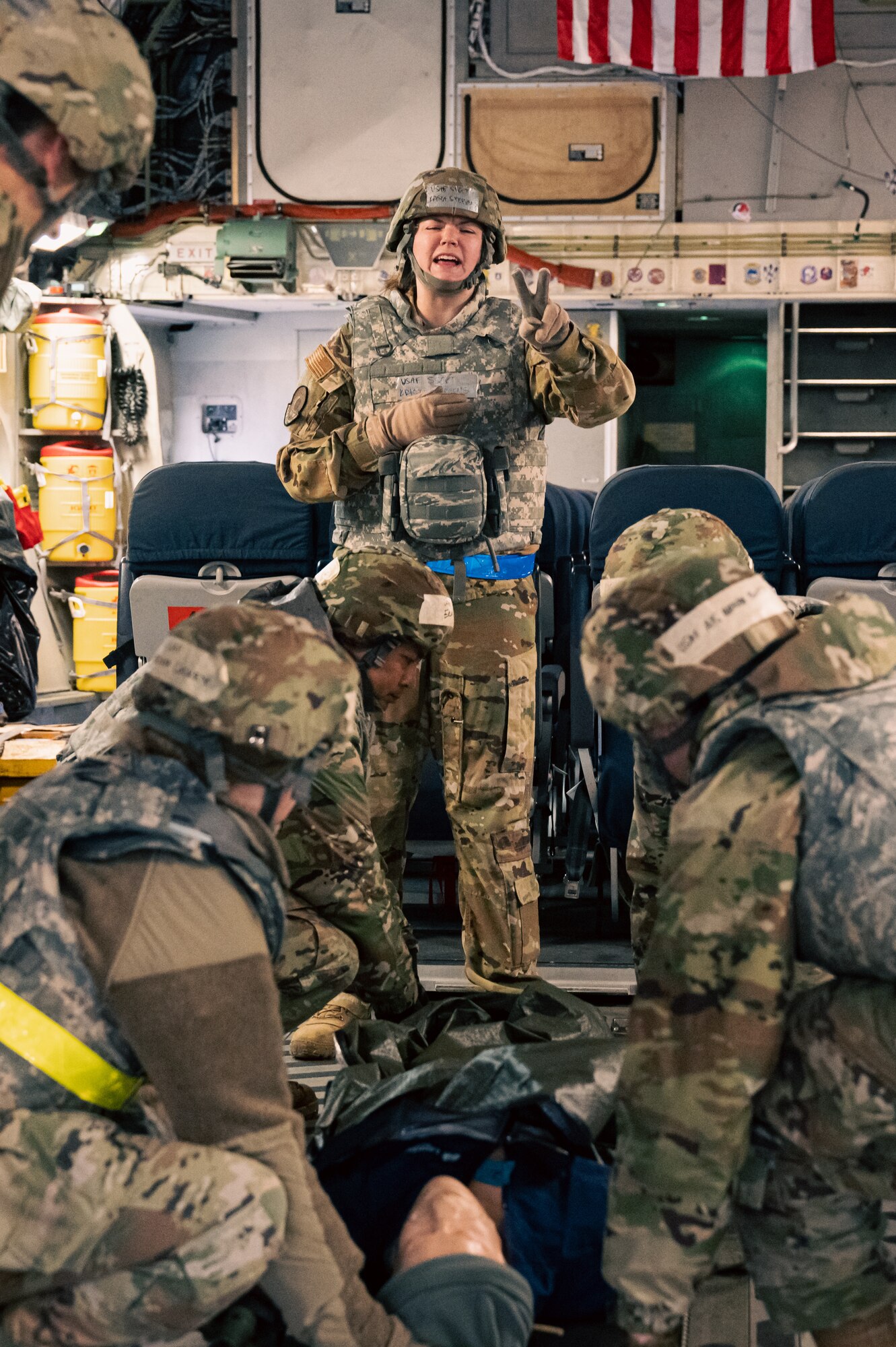 U.S. Air Force Staff Sgt. Krista Stephens 375th Aeromedical Evacuation Squadron aeromedical technician, directs Airmen moving a simulated patient during Belligerent Badger 23 on Volk Field Air National Guard Base, Wisconsin, April 16, 2023. As part of the BB 23, Airmen had to load simulated patients onto an aircraft to ensure they are prepared during a real-world emergency. (U.S. Air Force photo by Senior Airman Mark Sulaica)