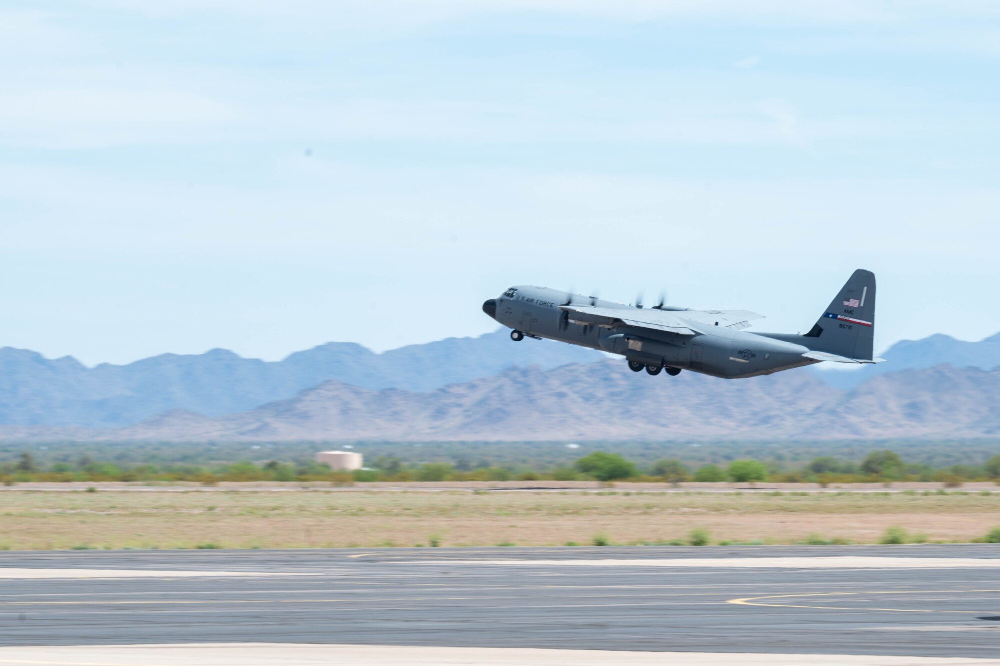A U.S. Air Force C-130J Super Hercules aircraft assigned to the 317th Airlift Wing, Dyess Air Force Base, Texas, takes off during exercise Wild Coyote, April 12, 2023, at Gila Bend Air Force Auxiliary Field, Arizona.