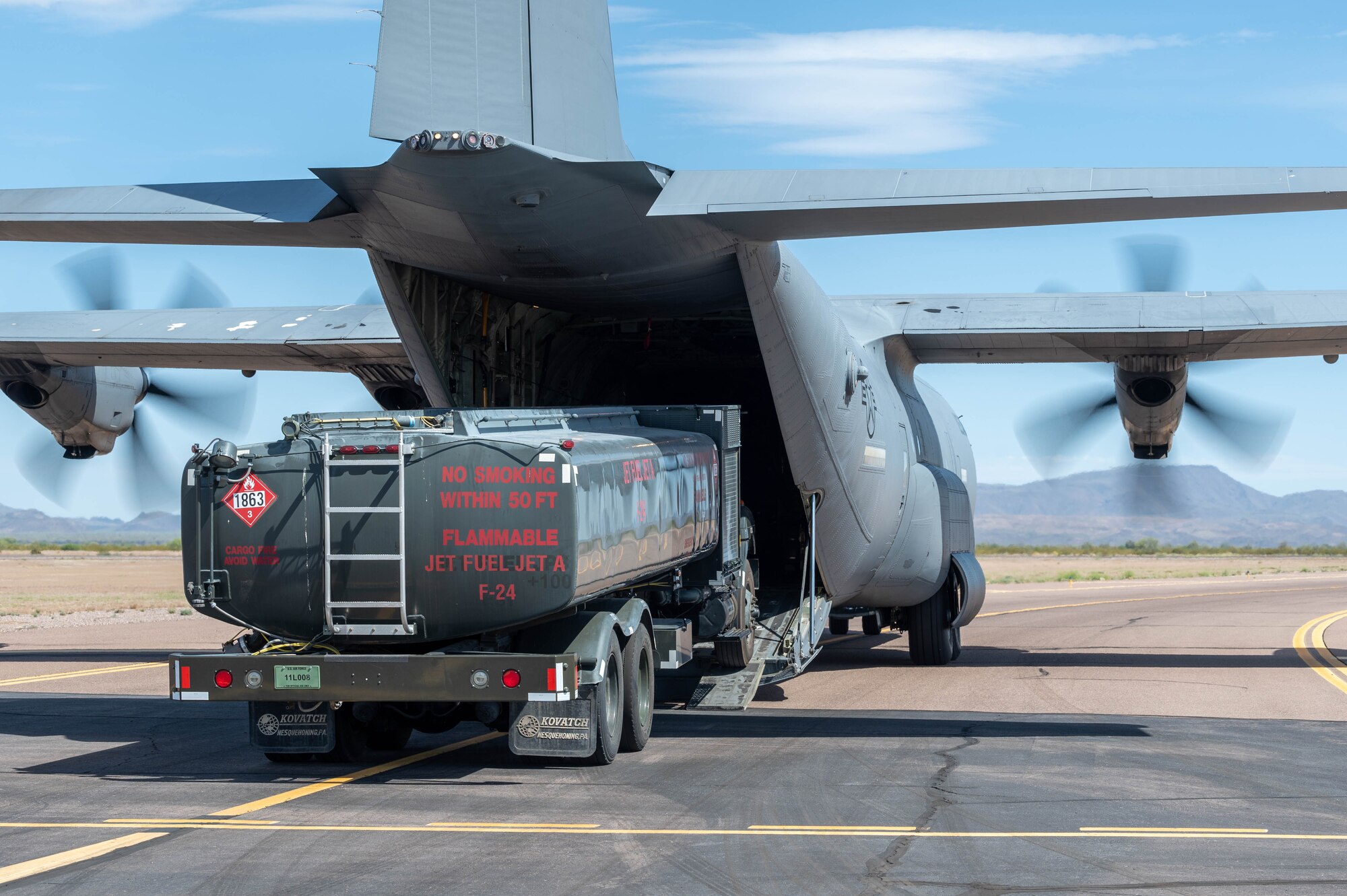 A U.S. Air Force R-11 refueler truck enters the cargo hold of a C-130J Super Hercules assigned to the 317th Airlift Wing, Dyess Air Force Base, Texas, during exercise Wild Coyote, April 13, 2023, at Gila Bend Air Force Auxiliary Field, Arizona.