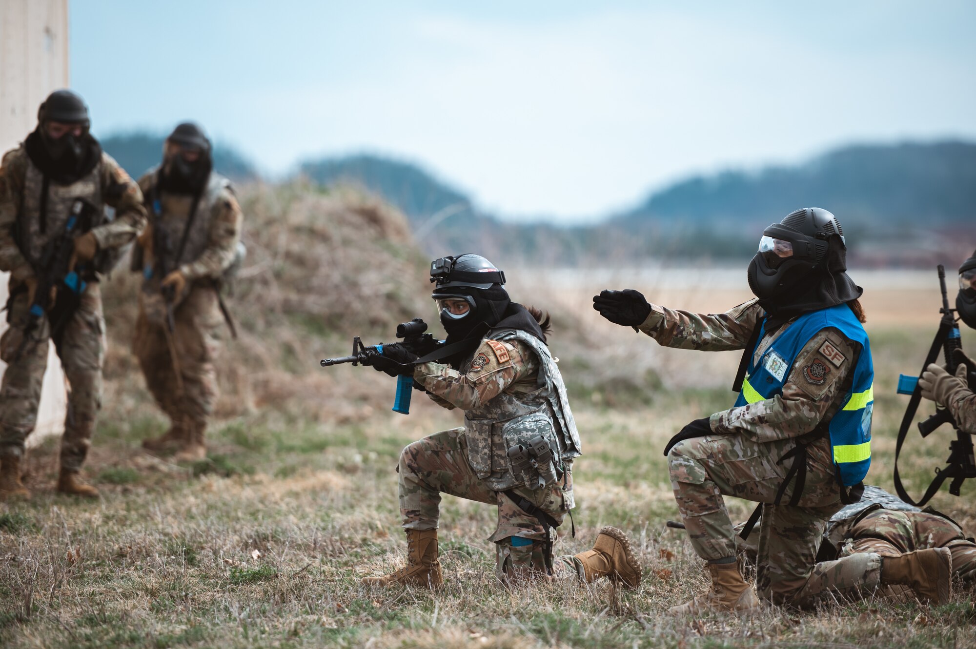 Airman 1st Class Sophia Guerrero, 375th Operations Support Squadron aircrew flight equipment, is instructed by a Wing Inspection Team member during a Joint Readiness Training Center exercise at Belligerent Badger 23 on Volk Field Air National Guard Base, Wisconsin, April 15, 2023. Approximately 50 Airmen went through the JRTC each day covering key readiness training like Tactical Combat Casualty Care, and chemical, biological, radiological and nuclear defense skills training. (U.S. Air Force photo by SrA Mark Sulaica)
