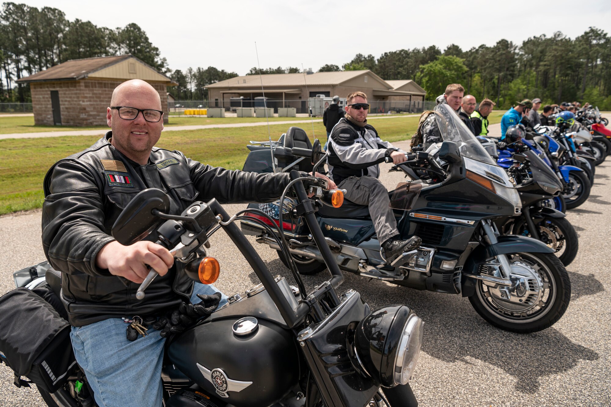 Bike riders pose for a photo.